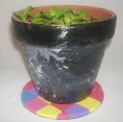 recycled CD plant pot stand