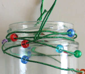 Beaded candle holder from glass jar
