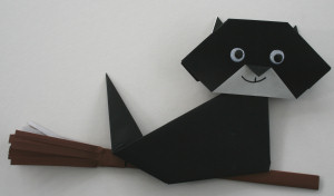 origami cat on broomstick