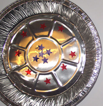 Pie plate cymbals decorated with stickers