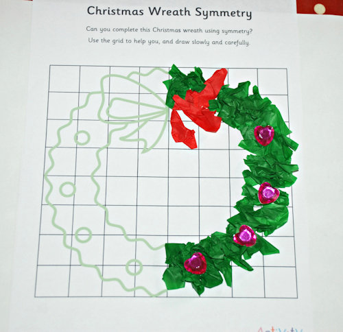 Christmas symmetry page completed using tissue paper and craft gems