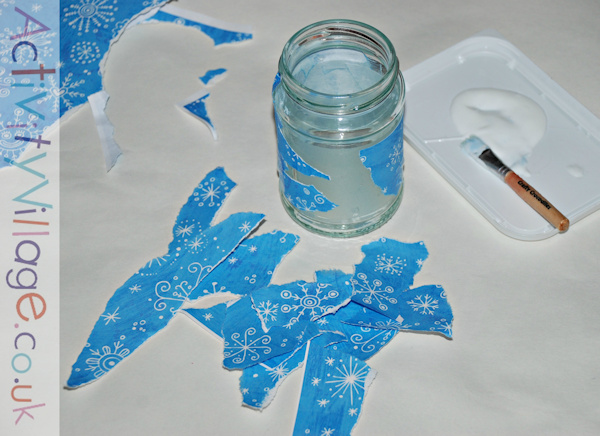 Decorating a bottle with snowflake scrapbook paper