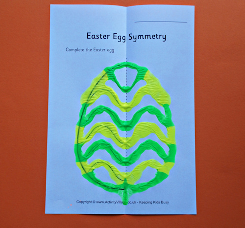 Green and yellow symmetrical egg painting