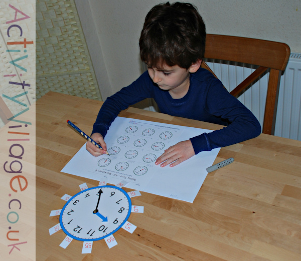 Using the teaching clock (with tags) while doing a worksheet