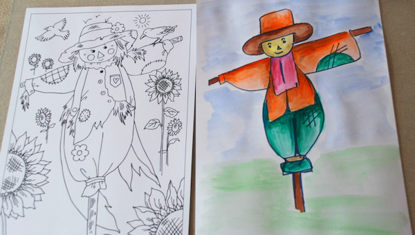Painting over the sharpie scarecrow with watercolour paints
