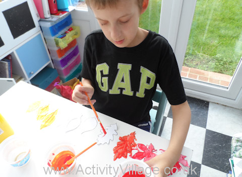 Colour mixing leaf display - Sam has mixed up some orange paint