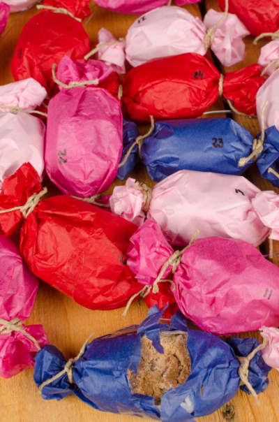Colourful tissue paper parcels for Advent
