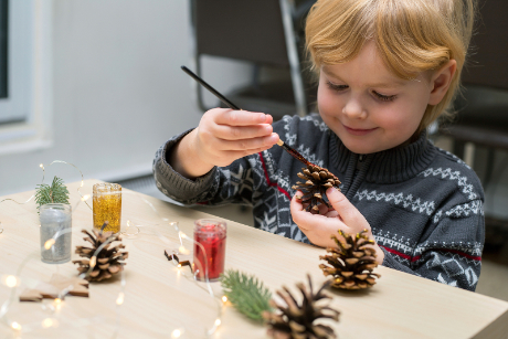 Paint pinecones to hang on the Christmas tree