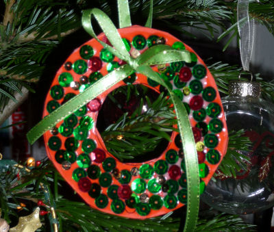 Sequined wreath hanging on our Christmas tree - we cheated a little and the glue isn't completely dry!