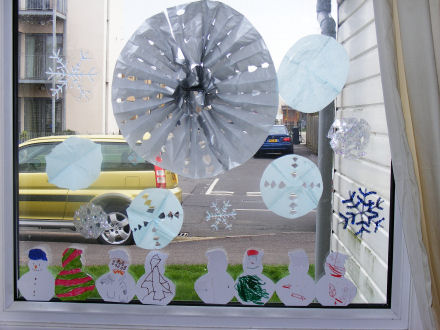 Our snowflakes and snowmen displayed in the window!