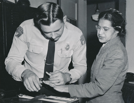 Rosa Parks being fingerprinted after her arrest for breaking the segregation law