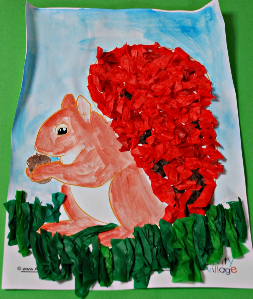 Squirrel with sky background painted and tissue paper grass added