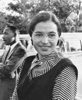 Rosa Parks, with Dr Martin Luther King Jr in the background